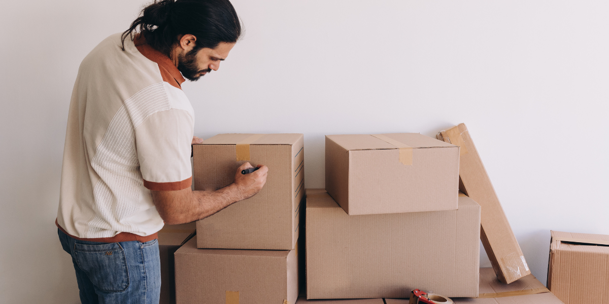 a man labelling a box